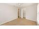 Comfortable bedroom offering neutral carpeting, a ceiling fan, ample closet space, and neutral paint at 845 N Ludlum Dr, Deltona, FL 32725