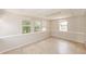 Spacious bonus room features tile flooring, ample natural light, and neutral wall paint at 845 N Ludlum Dr, Deltona, FL 32725