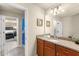 Bright bathroom featuring a single sink with granite countertops and nautical decor at 8804 Rhodes Street, Kissimmee, FL 34747