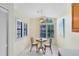 Bright breakfast nook with a cozy table, chairs, and plantation shutters, perfect for casual dining at 912 Augusta National Blvd, Winter Springs, FL 32708