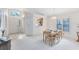 Open-concept dining area with bright natural light, seamlessly connected to other living spaces at 912 Augusta National Blvd, Winter Springs, FL 32708