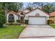 Charming single-story home with a two-car garage, well-maintained landscaping, and a welcoming facade at 912 Augusta National Blvd, Winter Springs, FL 32708