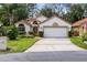 Charming single-story home with a two-car garage, well-maintained landscaping, and a welcoming facade at 912 Augusta National Blvd, Winter Springs, FL 32708