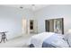 Bright primary bedroom boasts large windows, providing a view and a soothing color scheme at 912 Augusta National Blvd, Winter Springs, FL 32708