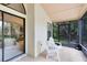 Relaxing screened patio with tiled floor and views of lush greenery, perfect for enjoying the outdoors at 912 Augusta National Blvd, Winter Springs, FL 32708
