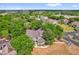 Scenic aerial view of a townhouse nestled among mature trees in a lush, green community at 948 Bird Bay Ct # 102, Lake Mary, FL 32746
