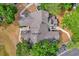 Aerial view of condo building with mature trees and sidewalks at 948 Bird Bay Ct # 102, Lake Mary, FL 32746
