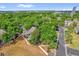 Aerial shot showcases lush landscaping and nearby parking area of a townhouse community at 948 Bird Bay Ct # 102, Lake Mary, FL 32746