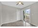 Bedroom with tile floors and sliding glass door to a patio at 948 Bird Bay Ct # 102, Lake Mary, FL 32746