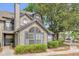 Charming townhome featuring a unique arched window and neat landscaping for enhanced curb appeal at 948 Bird Bay Ct # 102, Lake Mary, FL 32746