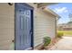 Inviting front entryway with a secure, blue door and modern lock system at 948 Bird Bay Ct # 102, Lake Mary, FL 32746