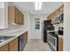 Efficient kitchen featuring modern appliances, ample cabinetry, and a sleek countertop for easy meal prep at 948 Bird Bay Ct # 102, Lake Mary, FL 32746