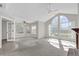 Spacious living room features large windows, a ceiling fan, and neutral tones for a serene atmosphere at 948 Bird Bay Ct # 102, Lake Mary, FL 32746
