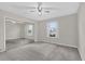 Spacious bedroom with a mirrored closet door and a large window providing natural light at 948 Bird Bay Ct # 102, Lake Mary, FL 32746