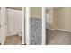 Bathroom and bedroom with tiled accent wall and doorway, with white door and white toilet at 955 Holly Springs Ter, Oviedo, FL 32765