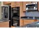 Kitchen showcases stainless steel appliances including double ovens and a built-in microwave at 955 Holly Springs Ter, Oviedo, FL 32765