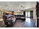 Spacious living room with hardwood floors, ceiling fan, and sliding glass door to backyard at 955 Holly Springs Ter, Oviedo, FL 32765