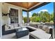 Covered patio featuring comfortable seating, ceiling fan, outdoor television and pool views at 955 Holly Springs Ter, Oviedo, FL 32765