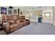 Home theater with leather recliners, mini fridge, movie posters, and a projector at 955 Holly Springs Ter, Oviedo, FL 32765