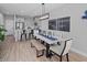 Modern dining area adjacent to the kitchen, featuring contemporary lighting and decor at 9968 Red Canoe Aly, Orlando, FL 32832