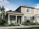 Charming two-story home with a welcoming front porch and well-maintained landscaping at 9980 Red Canoe Aly, Orlando, FL 32832