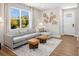 Bright living room showcasing a comfortable sectional sofa, and a large window with natural light at 9980 Red Canoe Aly, Orlando, FL 32832