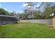Expansive backyard view with privacy wall, shed, and screened-in patio space at 1006 Hanging Vine Pt, Longwood, FL 32750