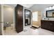 Bathroom featuring a large vanity, a step in shower, a commode in its own separate room, and a large cabinet at 1006 Hanging Vine Pt, Longwood, FL 32750