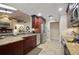 Bright kitchen features granite countertops, stainless steel appliances, and a skylight at 1006 Hanging Vine Pt, Longwood, FL 32750
