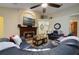 Cozy living room features a fireplace, comfortable seating, and a large TV at 1006 Hanging Vine Pt, Longwood, FL 32750