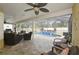 Inviting screened-in patio with stylish seating and a pool, perfect for relaxation and entertaining at 1006 Hanging Vine Pt, Longwood, FL 32750