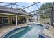 Enjoy the beautiful pool with waterfall, complemented by outdoor seating and a barbecue area at 1006 Hanging Vine Pt, Longwood, FL 32750