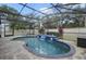 Inviting screened-in pool area with a waterfall feature and lounge chairs, perfect for outdoor relaxation at 1006 Hanging Vine Pt, Longwood, FL 32750
