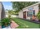 Charming backyard shed/office with a decorative entrance, enhancing the outdoor space at 12137 Buttonbush Loop, Leesburg, FL 34788