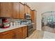 Well-equipped kitchen with stainless appliances, granite countertops, and plenty of cabinet space at 12137 Buttonbush Loop, Leesburg, FL 34788