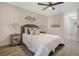 Serene bedroom featuring a ceiling fan, stylish decor, and new floors at 181 Pinewood Cir, Kissimmee, FL 34743