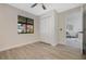 Bright bedroom with new floors and closet; the adjoining living room is visible at 181 Pinewood Cir, Kissimmee, FL 34743