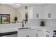 Modern kitchen featuring white cabinets, quartz countertops, subway tile backsplash, and stainless steel appliances at 181 Pinewood Cir, Kissimmee, FL 34743