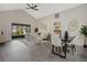 Bright and open living room with high ceilings, modern furnishings, and a view to the outdoors at 181 Pinewood Cir, Kissimmee, FL 34743