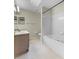 Bright bathroom with a tub and shower combination, toilet, and vanity with dual mirrors at 2244 Silver Lakes N Dr, Lakeland, FL 33810