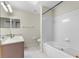 Bathroom featuring a shower and tub combination, vanity with mirror, and neutral tile flooring at 2244 Silver Lakes N Dr, Lakeland, FL 33810
