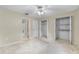 Bedroom with carpet flooring, white walls, bathroom entrance, and an ample closet space at 2244 Silver Lakes N Dr, Lakeland, FL 33810