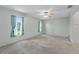 Spacious bedroom featuring a ceiling fan and two windows at 2244 Silver Lakes N Dr, Lakeland, FL 33810