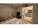Comfortable bedroom featuring neutral tones and ensuite bathroom entrance at 2244 Silver Lakes N Dr, Lakeland, FL 33810