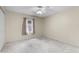 A bedroom with wall to wall carpeting, ceiling fan, and one window at 2244 Silver Lakes N Dr, Lakeland, FL 33810