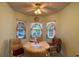 Bright dining area featuring a ceiling fan, comfortable seating and large windows with backyard views at 2244 Silver Lakes N Dr, Lakeland, FL 33810