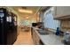 Well-equipped kitchen with black appliances, breakfast bar and open layout leading to the dining area at 2244 Silver Lakes N Dr, Lakeland, FL 33810