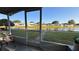 Inviting screened-in lanai with peaceful water views and seamless access to the landscaped backyard at 2244 Silver Lakes N Dr, Lakeland, FL 33810