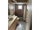Bathroom with a vanity, toilet, and tiled shower and bathtub combination at 2342 Cilantro Dr, Orlando, FL 32837