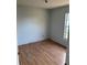 Bedroom featuring laminate flooring and a window bringing in natural light at 2342 Cilantro Dr, Orlando, FL 32837